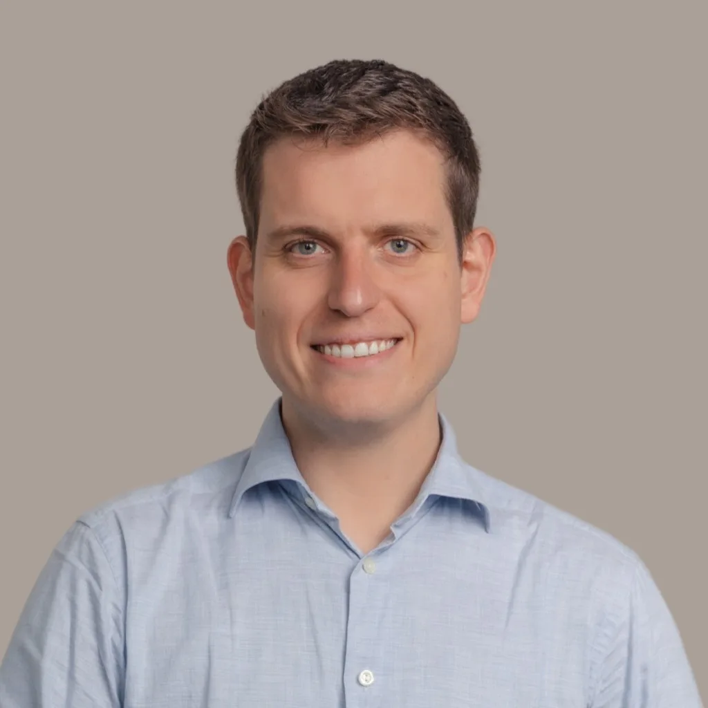 Jeroen De Koninck smiling, in a light blue shirt