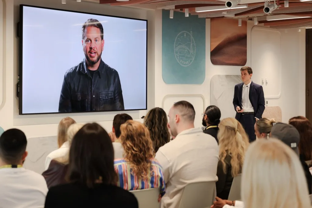 Audience at a Sydney event watching Jeroen De Koninck present on screen beside a live host for the Pinterest and Triple Whale partnership